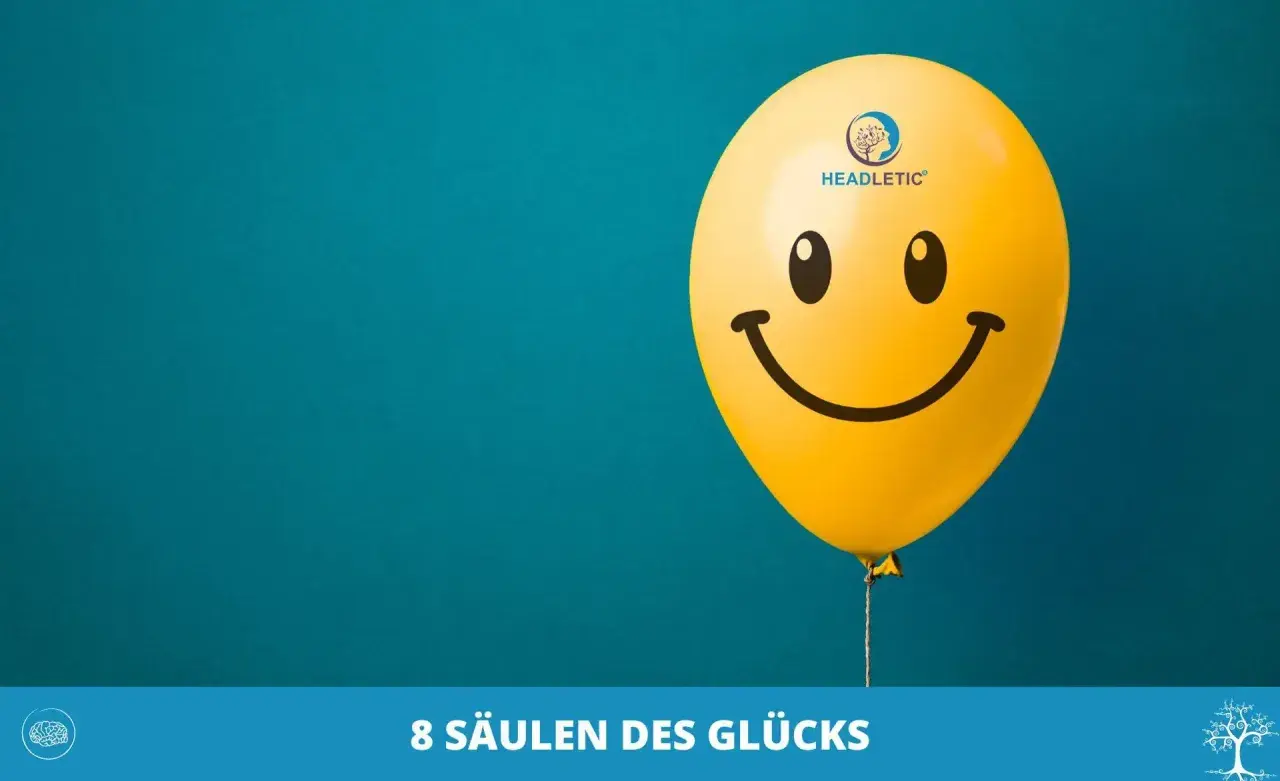 Ein gelber Smiley-Ballon schwebt vor blauem Hintergrund. Er symbolisiert das Ende der Unzufriedenheit im Leben und die Suche nach Glück.
