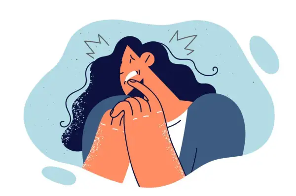 Verzweifelte Frau mit dunklen Haaren, die sich die Finger in den Mund steckt. Ein Symbol für Schuldzuweisung in der Psychologie, das innere Qualen darstellt.